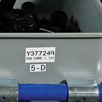 En flerformålsetikett som brukes på en plukkboks.